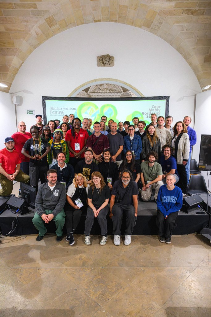 Group of academics at Connect Festival posing for photo on stage